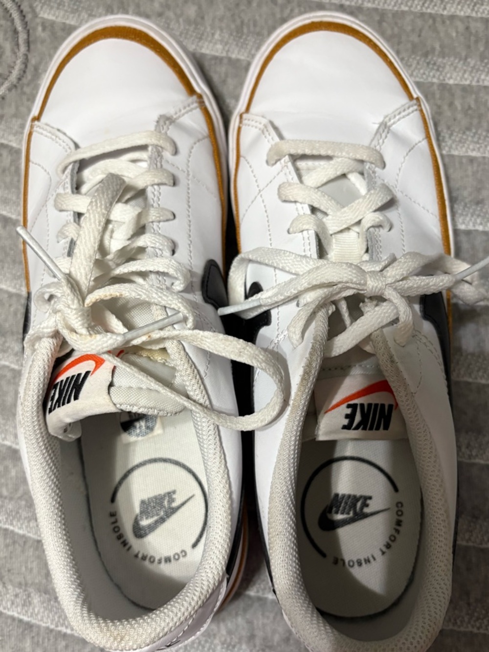Nike White Leather Sneakers with Black Swoosh and Gum Sole Trim